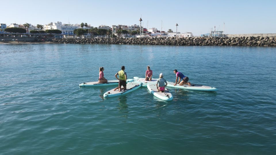 Arguineguín: Stand-up Paddleboard Yoga Class with Instructor - The yoga flow on your board: core strength without the gym vibe