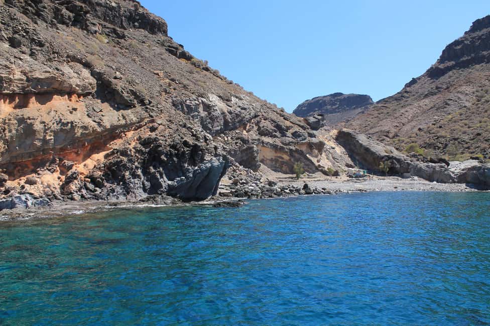Explore Gran Canaria: Boat Tour with Wine & Food Tasting - Onboard comfort: deck time, drinks, and host-led storytelling